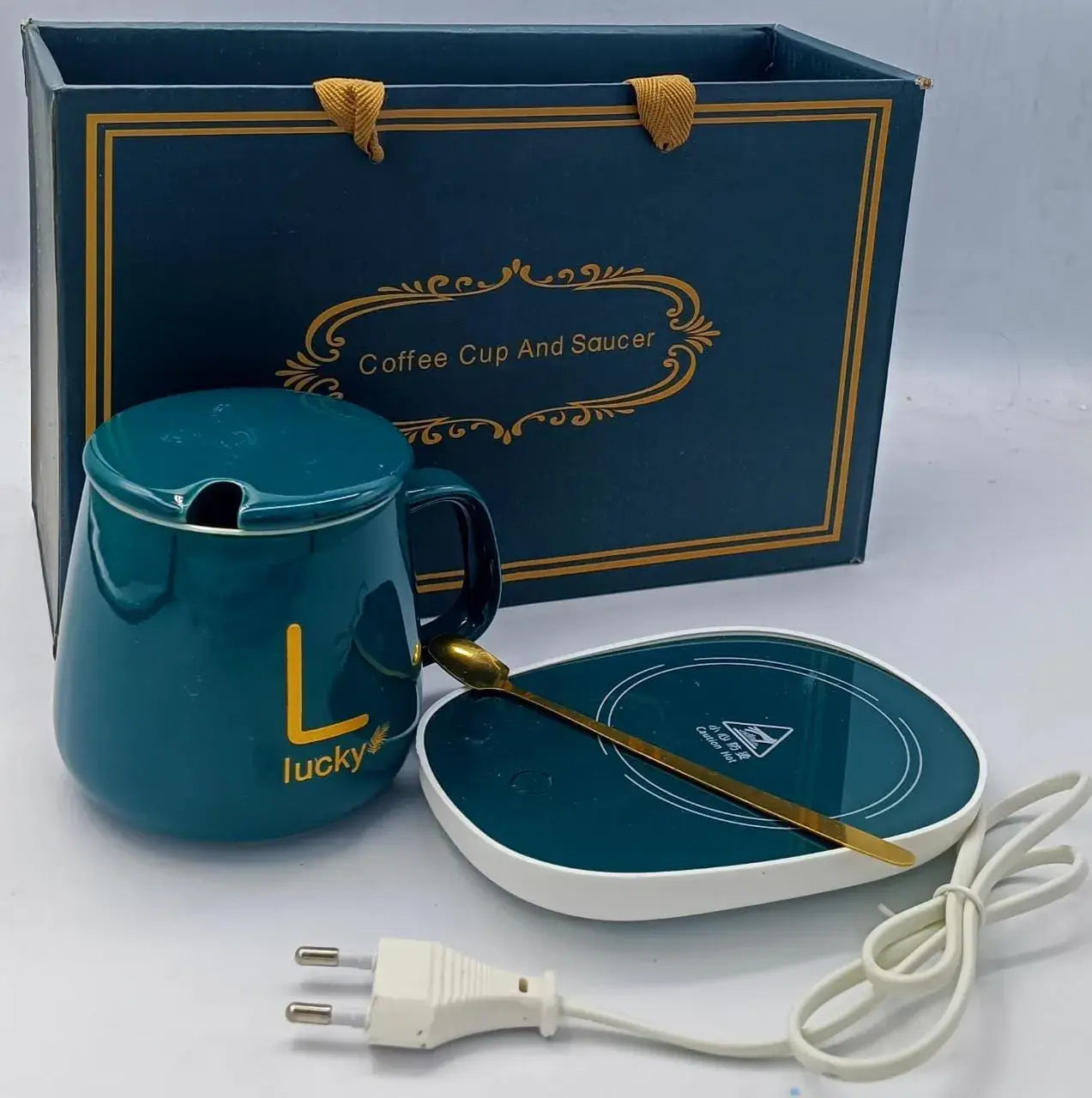 Smart electric coffee mug warmer with temperature control on an office desk in Riyadh.