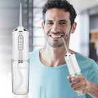 Oral flosser with four replaceable jet tips