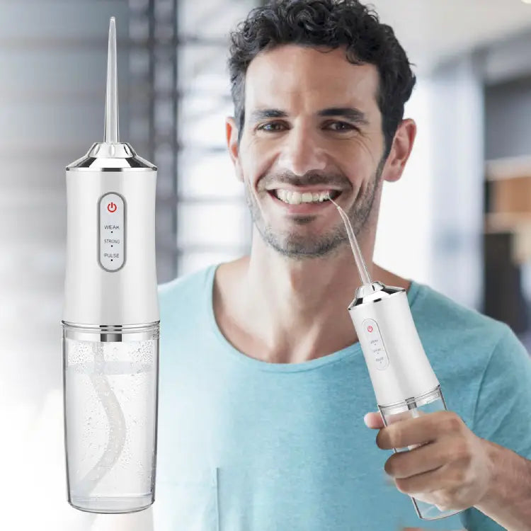 Oral flosser with four replaceable jet tips